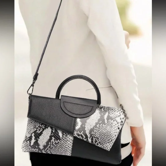 Black snakeskin print vegan leather clutchcrossbody bag